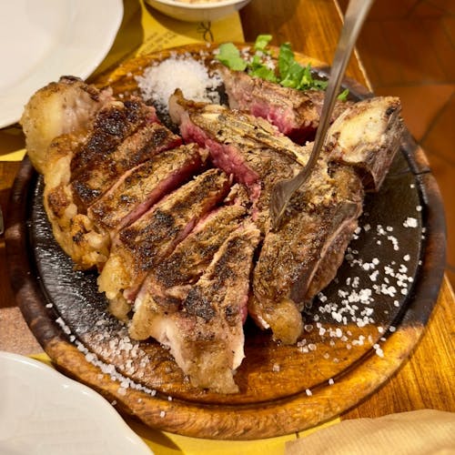 Florentine-style steak cooking experience with a chef and unlimited wine